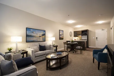 Suite sitting area with a sofa, armchairs and coffee table.
