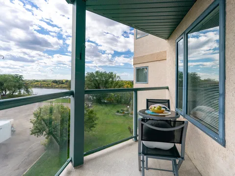 Balcony with a chair and river view.