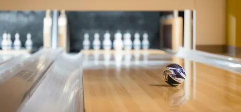 Bowling lane with a ball and pins