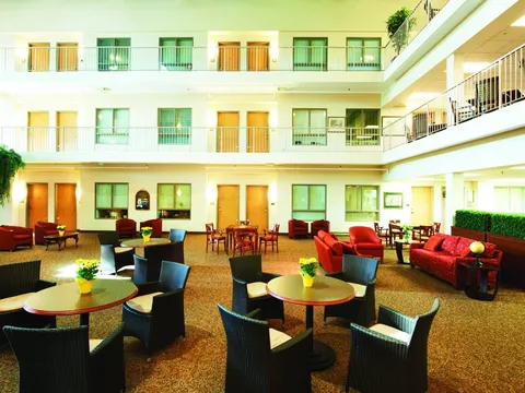 Atrium with tables, chairs, sofas and balconies