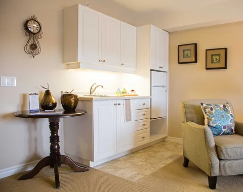Kitchenette beside a suite sitting area.
