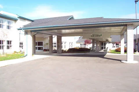 Covered driveway and building entrance beneath a wide canopy