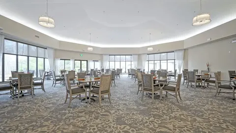 Dining room with tables, chairs and large windows