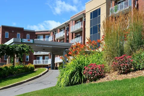 Residence buildings and landscaped entrance garden.