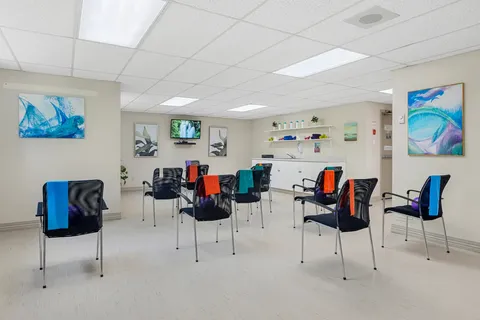 Exercise room with chairs, exercise bands and shelves of small weights