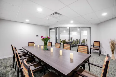 Long dining table and wooden chairs.