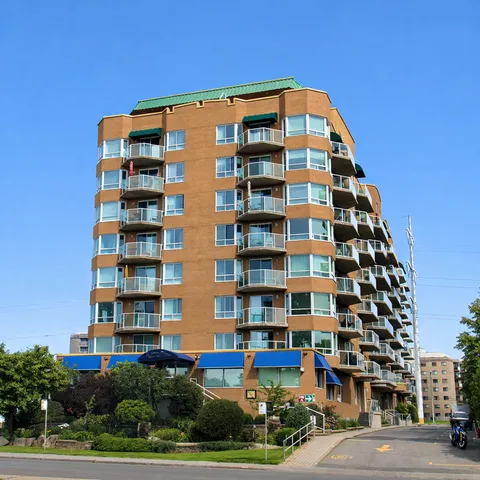 Residence tower and entrance viewed from the street.