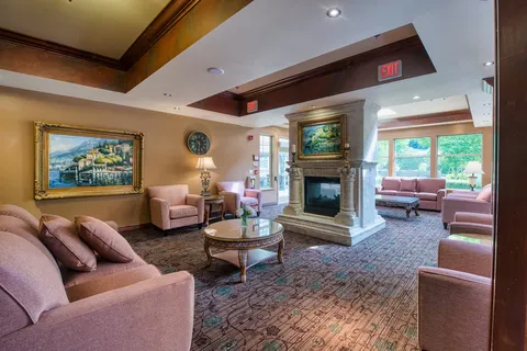 Lounge with sofas, armchairs and a stone fireplace