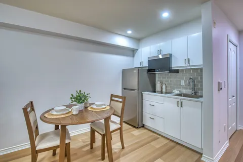 Suite kitchenette and dining table with place settings