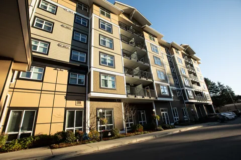 Building façade with balconies and large ground-floor windows