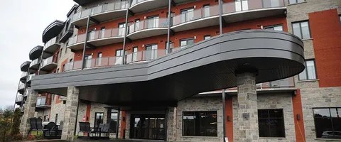 Residence entrance canopy and balconies above.