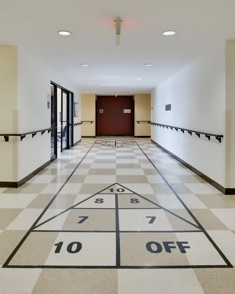 Hallway with a shuffleboard court marked on the tiled floor