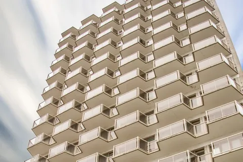 Low-angle view of a multi-storey brick residence