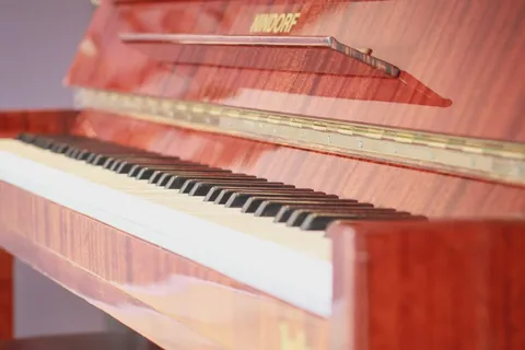 Close-up of a wooden piano and its keys