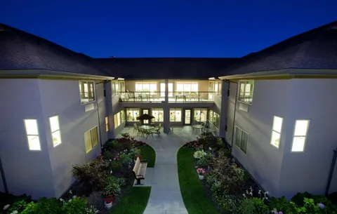 Elevated evening view of the residence and landscaped courtyard