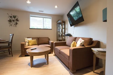 Sitting room with sofas, a coffee table and a television