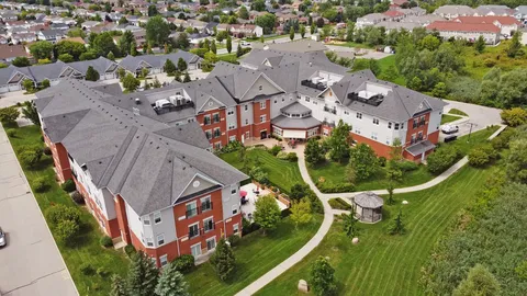 Aerial view of a residence building and lawns