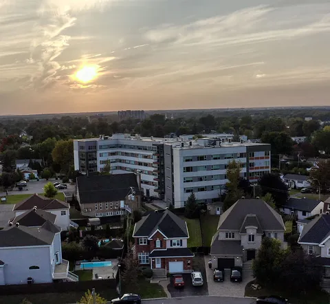 Aerial view of the residence and neighbouring houses at sunset