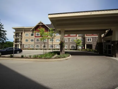 Covered entrance drive beside the building.