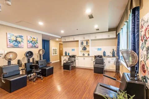 Hair salon with styling chairs and hood dryers