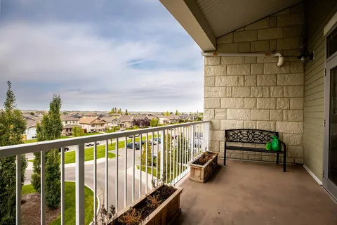 Covered balcony with a bench and planter boxes