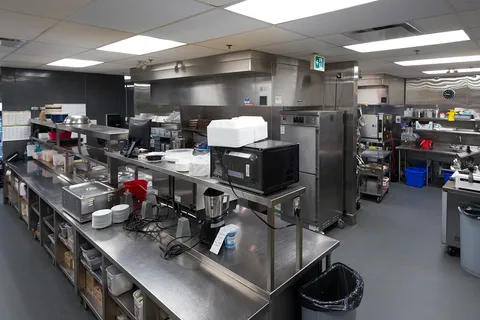 Commercial kitchen with stainless steel counters and appliances
