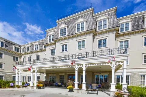 Residence exterior with balconies and a covered entrance