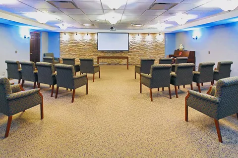 Cinema room with seating and a projection screen