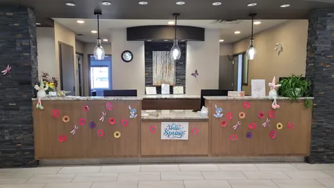 Reception desk with pendant lights, stone columns and seasonal decorations