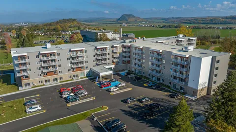 Aerial view of the residence building and front parking area.