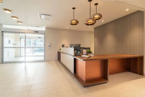 Reception desk beside the residence entrance.