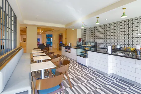 Bistro counter with tables and chairs.