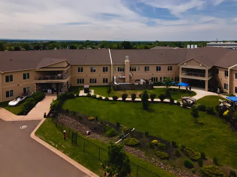 Aerial view of the residence buildings around a landscaped courtyard.