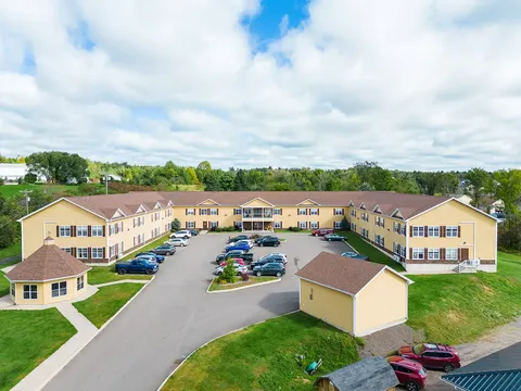 Aerial view of yellow residence buildings around a courtyard