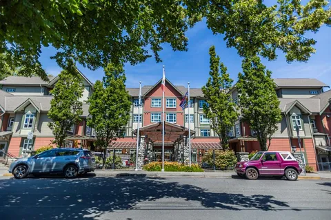 Residence beside a road with trees and landscaped grounds