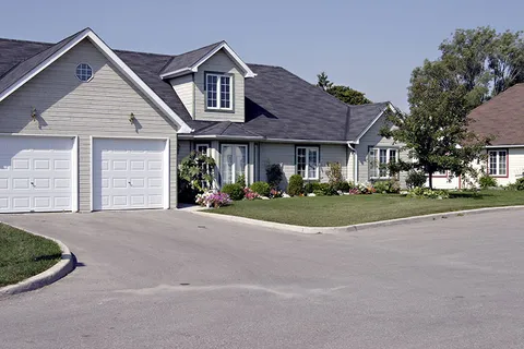 Bungalow with a garage beside the residence.