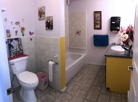 Bathroom with tub, shower, toilet and vanity.