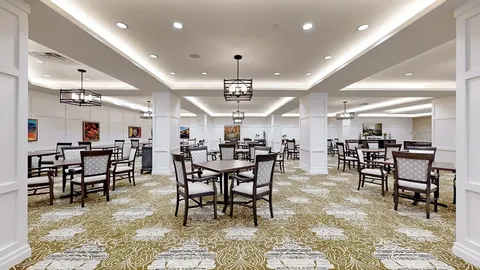 Dining room with tables, chairs and rectangular pendant lights