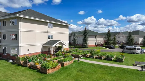 Raised garden beds beside the residence.