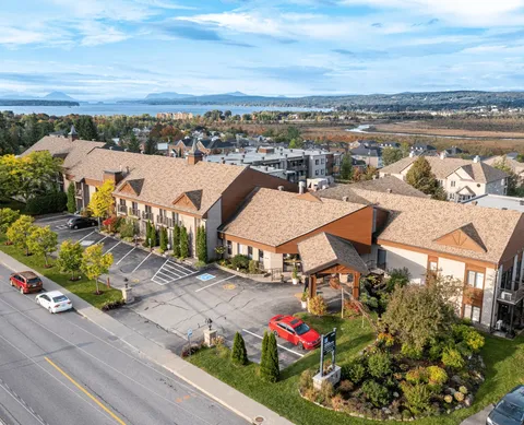 Aerial view of the residence, entrance drive and surrounding grounds
