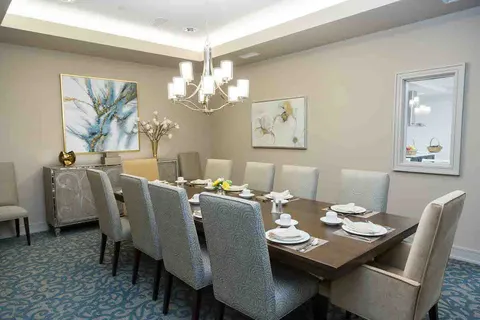 Dining table with upholstered chairs in a decorated room