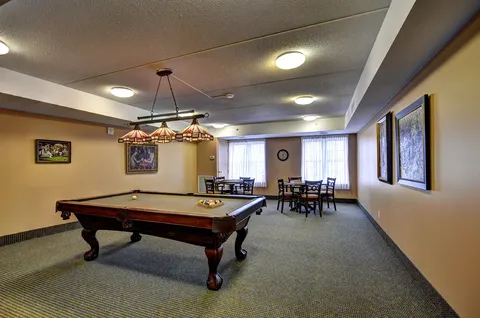 Billiards room with pool table and dining set