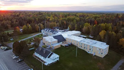 Aerial evening view of the residence campus, surrounding roads and trees