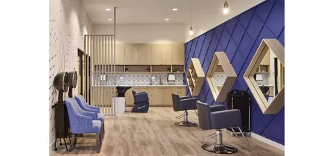 Salon with styling chairs and wall mirrors