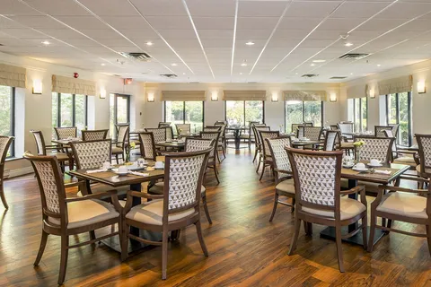 Dining room with set tables and large windows