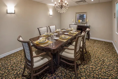 Private dining room with a long table and sideboard