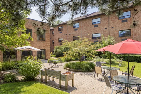 Courtyard patio with umbrella tables and garden beds