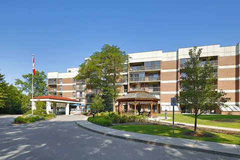 Residence exterior with balconies and a covered entrance