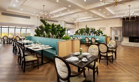 Dining room with set tables and booth seating