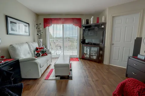 Suite living area with a sofa and armchair.